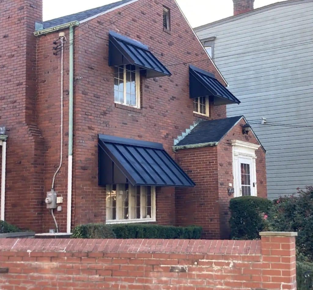 house with standing seam awning
